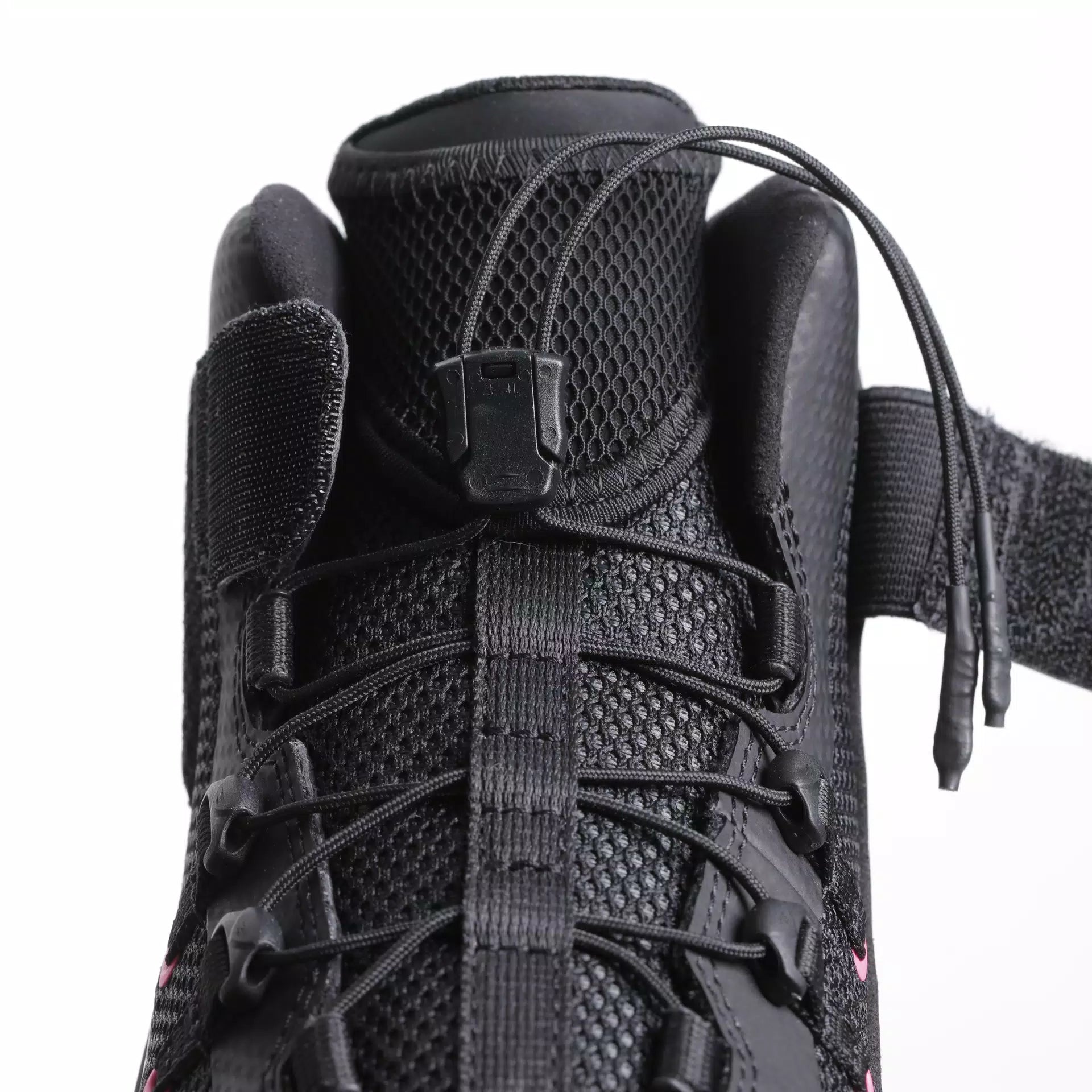 Dainese Herian Air women's racing summer motorcycle shoes in black and fluorescent pink fabric, designed for riding comfort.