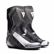 Dainese Torque 4 S black and white racing motorcycle boots with protective armor and sleek design.
