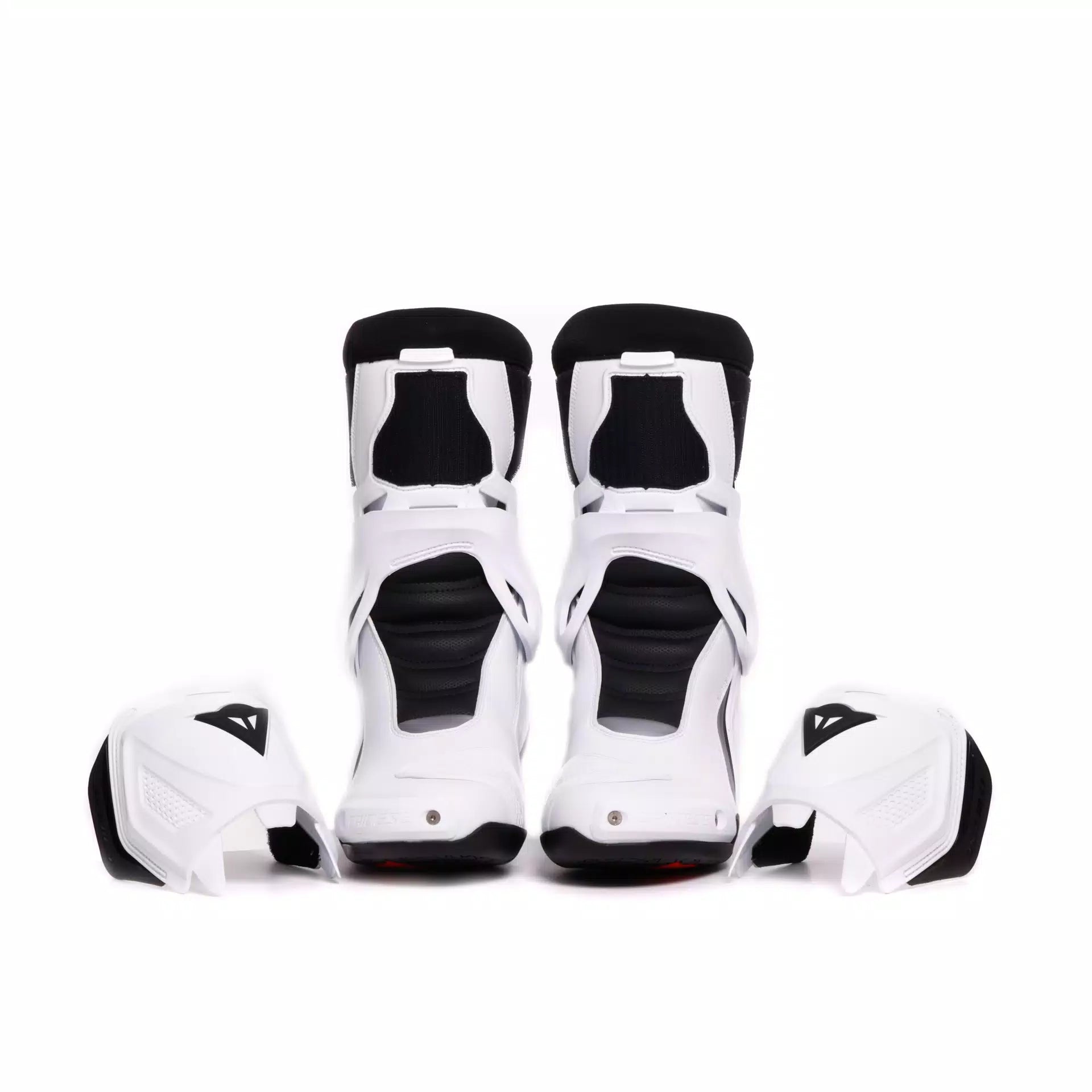 Dainese Nexus 3 motorcycle racing boots in black and white with protective features and sleek design.