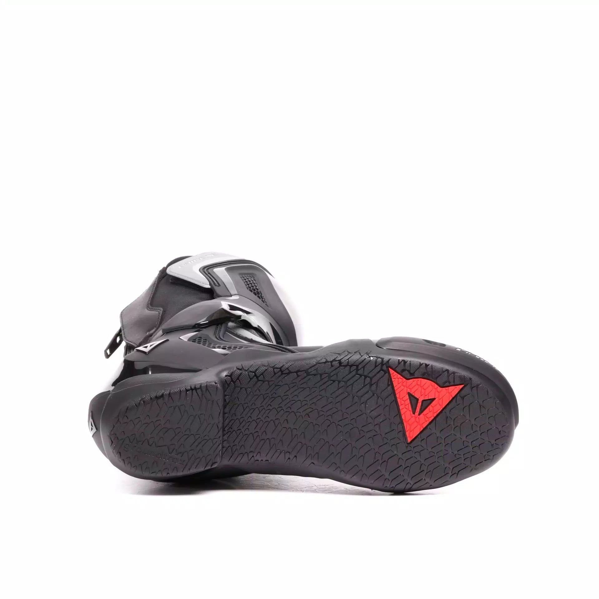 Black Dainese Nexus 3 racing motorcycle boots with protective features and sleek design.