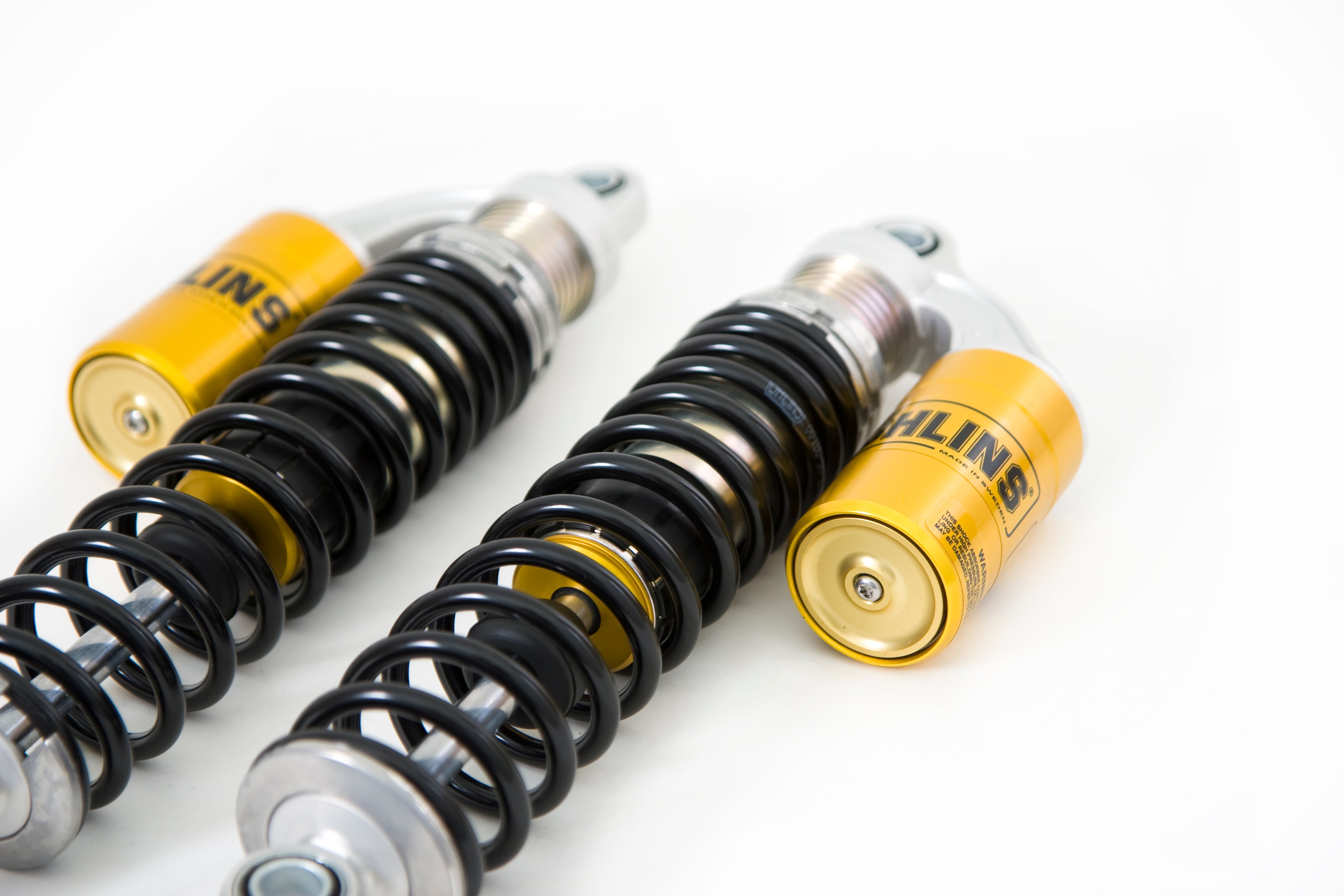 Ohlins S36PL rear shock absorber for Indian Bobber 2021-25, showcasing its sleek design and durable construction.