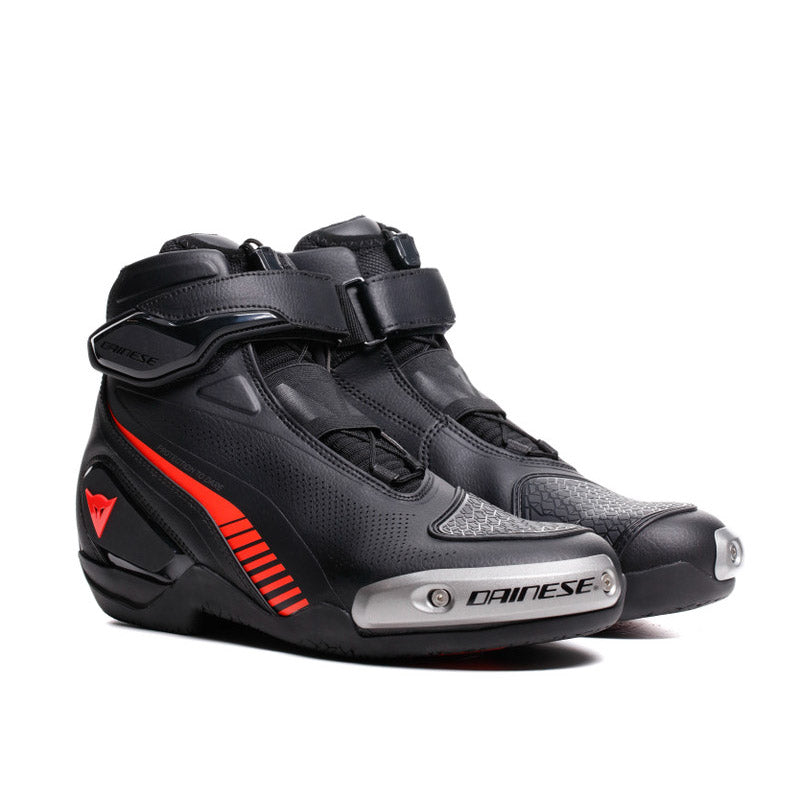 Dainese Superya black and red fluo racing motorcycle shoes with protective design and sporty look.