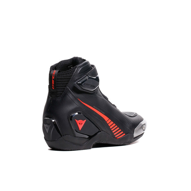 Dainese Superya racing motorcycle shoes in black and red fluoro with protective design and sporty appearance.